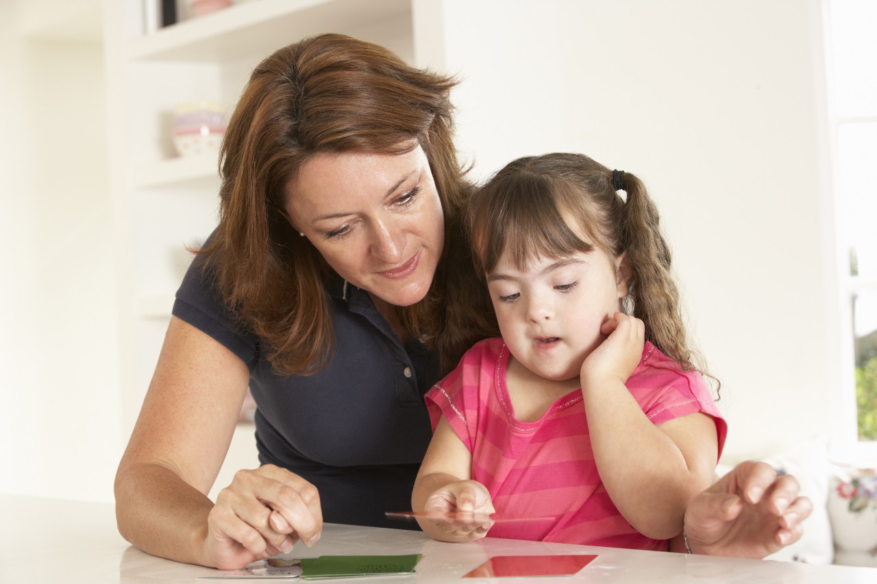 lady-teaching-little-girl lady teaching and reading with little girl