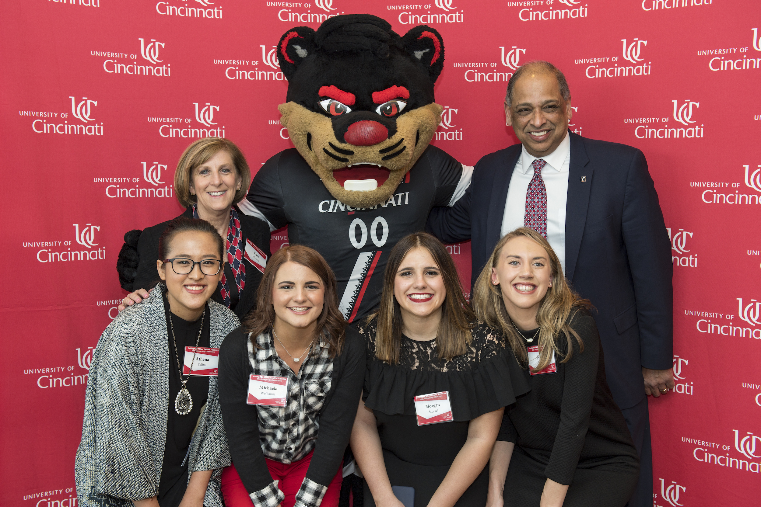 Alumni with dean, president and Bearcat at anniversary celebration