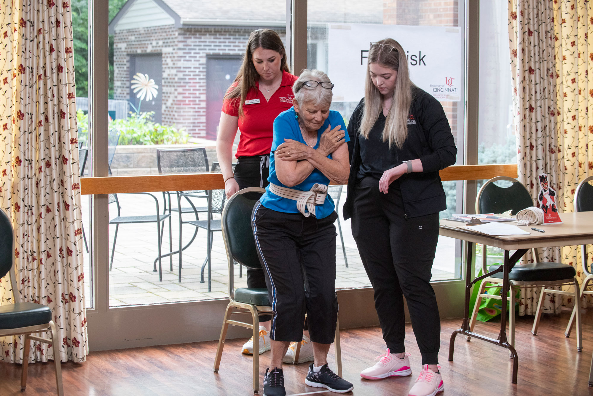 Occupational therapy students work with a patient