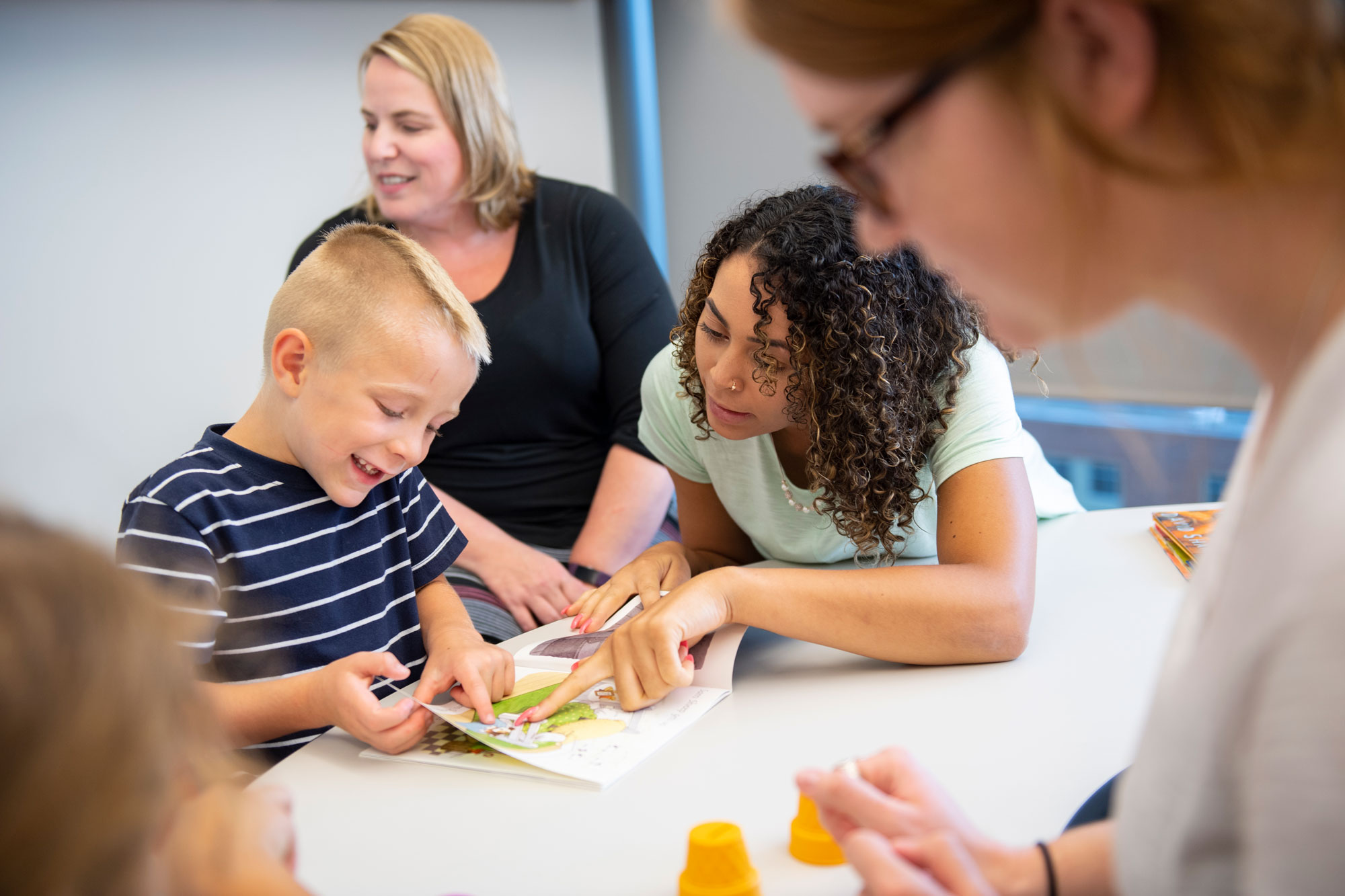 A Speech and Hearing student in the College of Allied Health Sciences works with a young patient